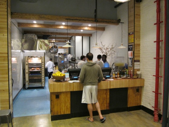 Counter and kitchen of Dirty Bird To-Go on Chambers Street, Tribeca.