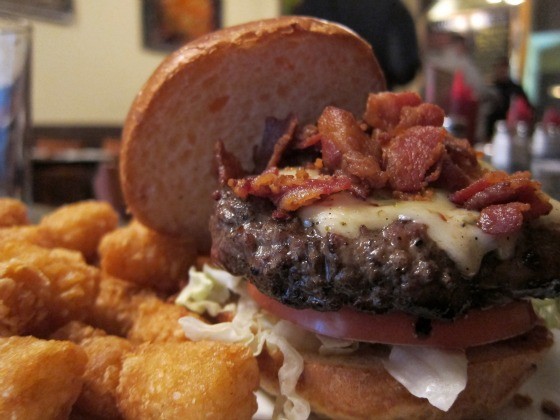 A thick, juicy New York City burger topped with melted cheese and bacon, located at the Burger Bistro in New York’s Upper East Side.