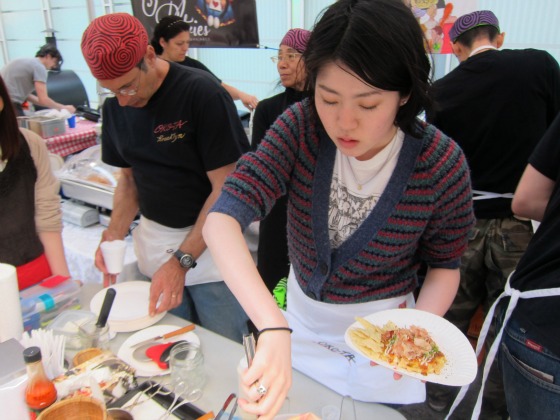 Women preparing a serving of Thai food at the Hester Nights food fair