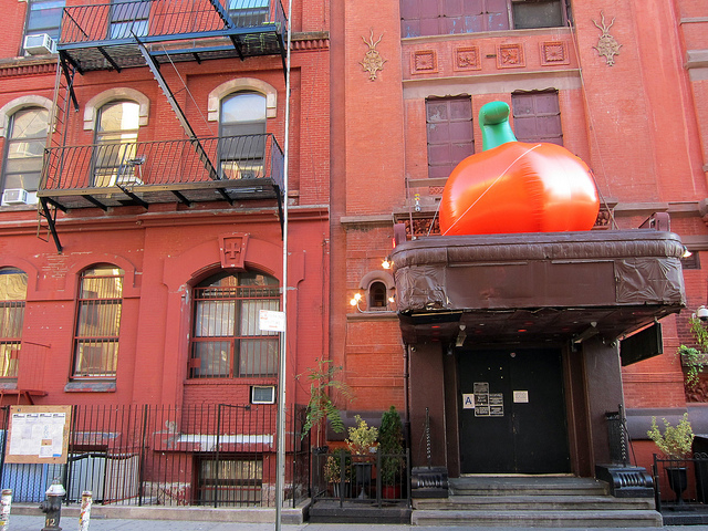 The exterior of Webster Hall, dressed up with a huge inflatable pumpkin sitting on the main entrance way