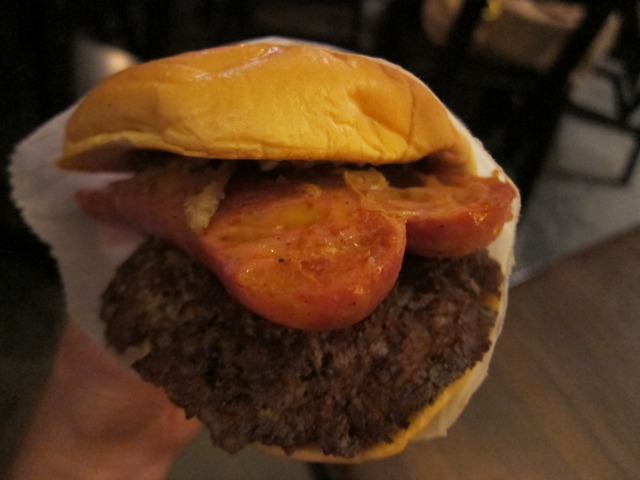 Image of the Shake Shack's Cheddar Brat Burger which hits their menu for their annual Shacktoberfest