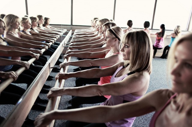 Group of women attend the ballerina inspired workout routine Barre in NYC