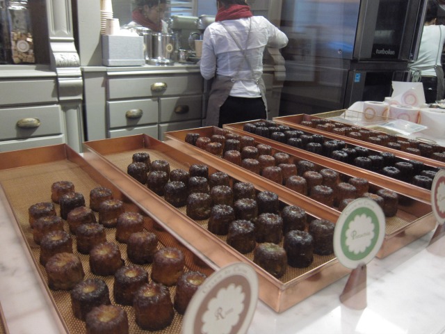 An image of a display case of the dark chocolate and caramel canelés