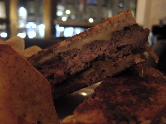 Image of the Empire Diner's Patty Melt, beef, with swiss cheese, caramelized onions on rye bread