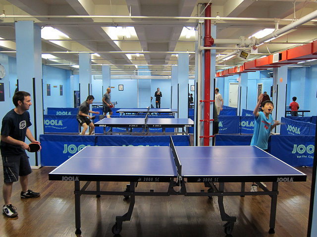 Two guys playing table tennis at King Pong in NYC