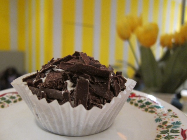 Image of a merveilleux Belgian pastry topped with sprinkled chocolate chunks