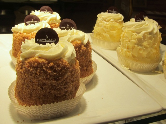 Within the glass display at O'Merveilleux are 6 belgian style pastries called the merveilleux