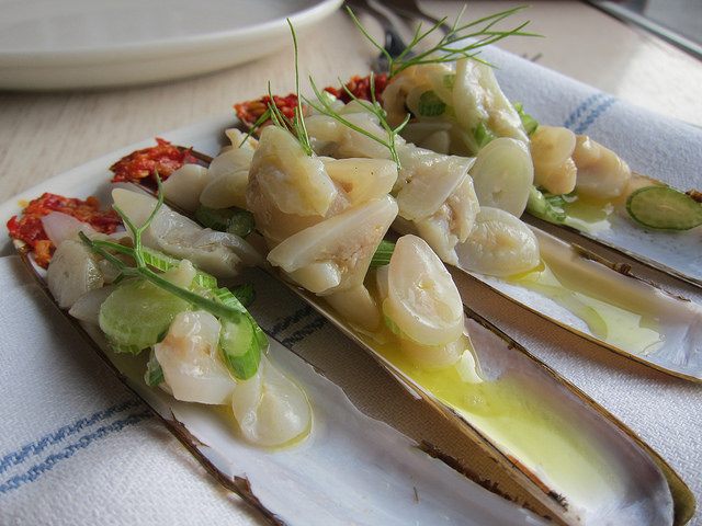 Four elegantly prepared razor clams at Charlie Bird SOHO