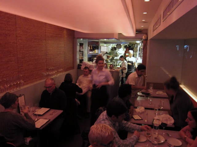 A busy waitress tending to tables in the vegetarian East Village hotspot, Dirt Candy.