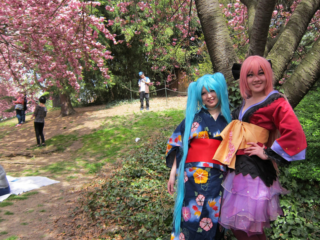 two young women dressed in playful Asian clothing during the Cherry Blossum Festival at the New York Botanic Garden