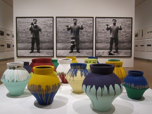 Ai Weiwei's multi-colored vases and black and white images of a man dropping a vase at the Brooklyn Museum copy