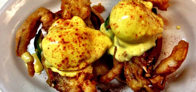 Image of a plate of baked and breaded crabs with avacado and eggs on top from Clinton Street Baking Company