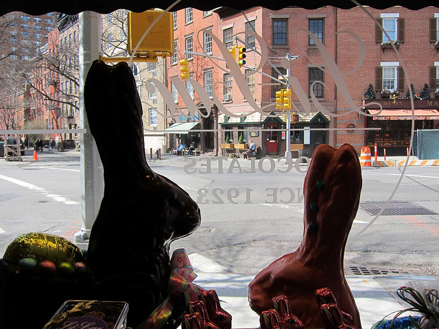 From the window of NYC chocolate shop Li Lac Chocolate looking outside with Easter chocolate bunnies blocking the view to the street