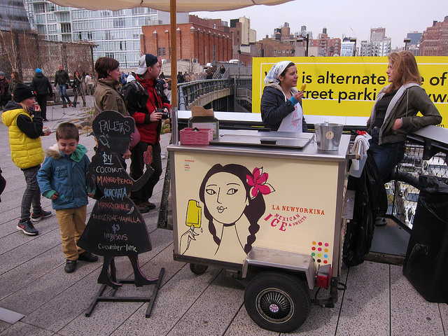 People stop to enjoy some ice cream at La Newyorkina's food cart at the High Line in NYC