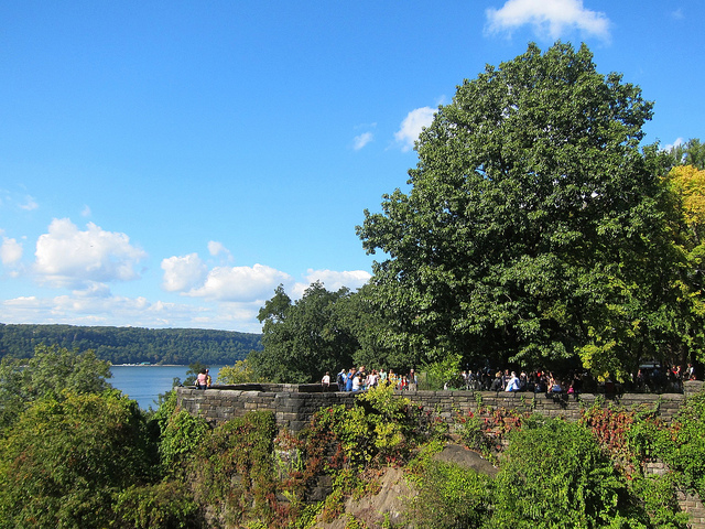 Tourists walking the path at Fort Tryon on a sunny day