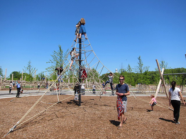 Children play and climb up on the new playground structures on Governors Island.