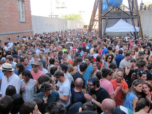 An image of the courtyard of MoMA PS1 packed with crowds from Warm Up! 2013 event.