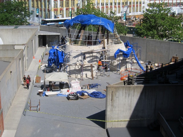 Ariel view of The Living's Hy-Fi installation being put together by a team of construction workers