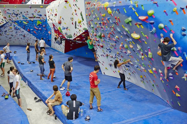 Image people enjoying the indoor rock climbing facility in Long Island City called the Cliffs
