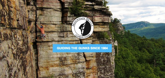 An image from the Gunks' website of a man rock climbing among beautiful mountain views.