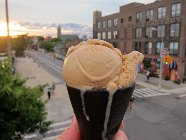 A chocolate ice cream cone with a scoop of butterscotch pudding ice cream from Ample Hills melts in the Brooklyn sun.