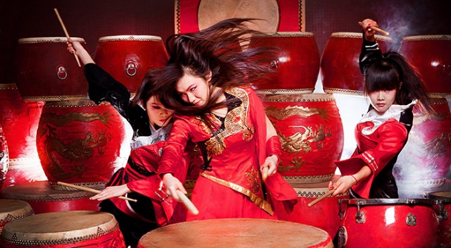 Three members of the ensemble of Mulan: The Percussion Musical perform