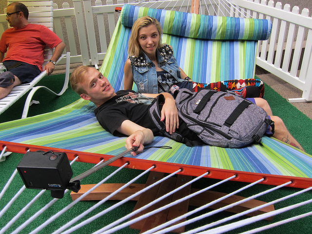  A couple lounges on a colorful hammock at one of the rest area at NYC's Summer Streets