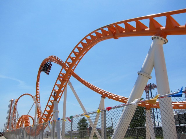 A group of people ride through the looping track of the brand new Thunderbolt roller coaster on Coney Island.