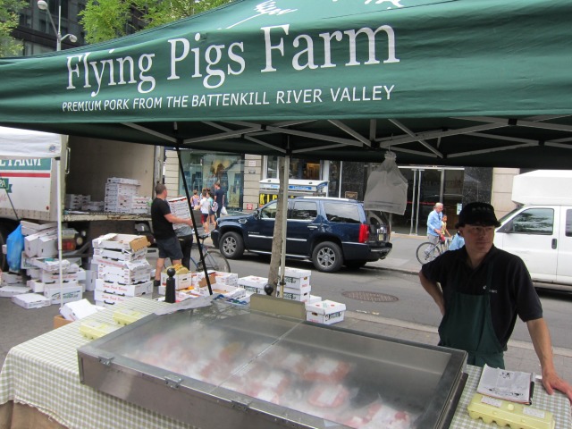 In Union Square, Flying Pigs Farm sets up a pop-up tent to sell their meat to New Yorkers
