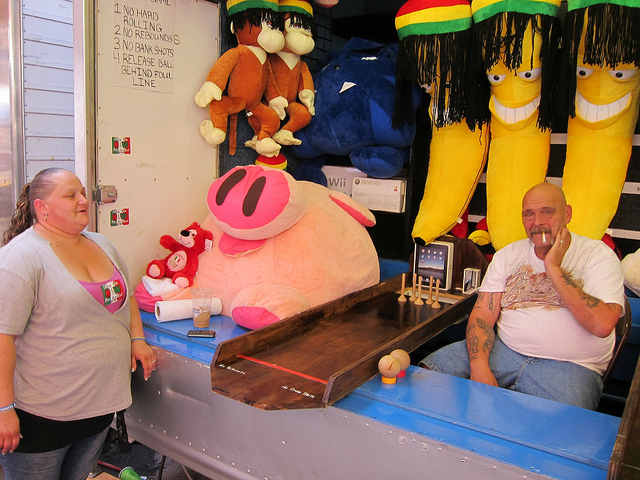 Two vendors, Maude and Bruce working the games at NYC's San Genarro festival.