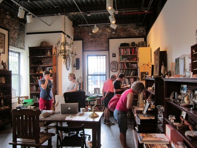 Patrons browse in the library section of Brooklyn's Morbid Anatomy Museum