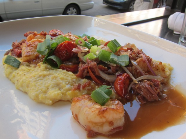 Fresh shrimp served over a plate of warm grits from Root & Bone