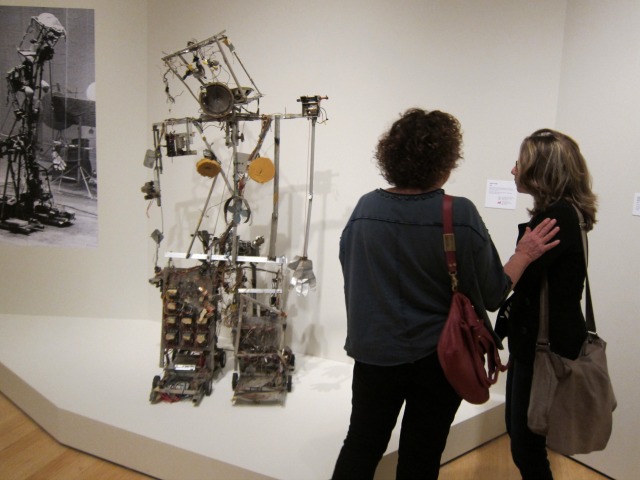 Museum-goers taking in one of the robots at the latest exhibition at the Asia Society Museum