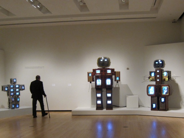 Three large robots designed by artist Naim June Paik line the walls of the Asia Society Museum in NYC.