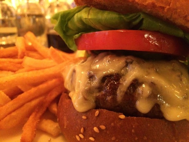 Cherche Midi's prime rib burger served with fries. 