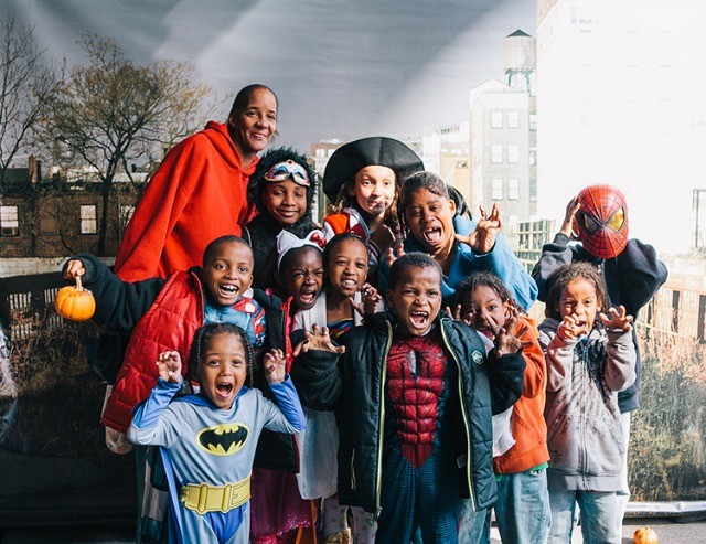 Children in costumes ready for Halloween fun.