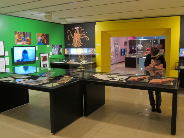 An onlooker checks the Sesame Street exhibit at Lincoln Center's New York Public Library.