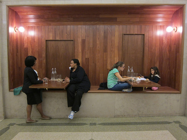 Patrons sitting and eating inside Arcade Bakery - now in Tribeca.