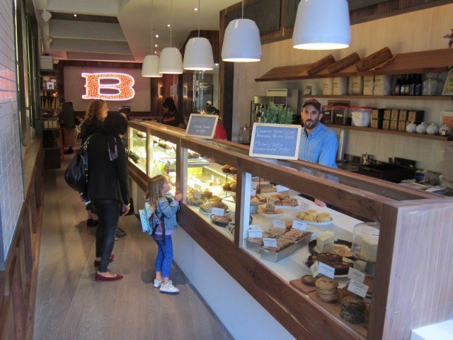 A mother and child look at the pastries displayed at Baked Tribeca
