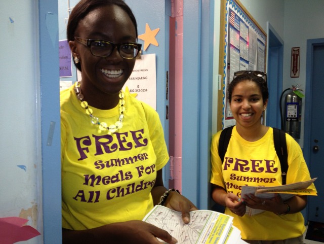 Students smiling, offering free summer meals for children at the NYC Coalition Against Hunger