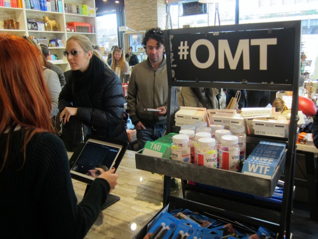 Patrons wait on line to pay at Story in Chelsea