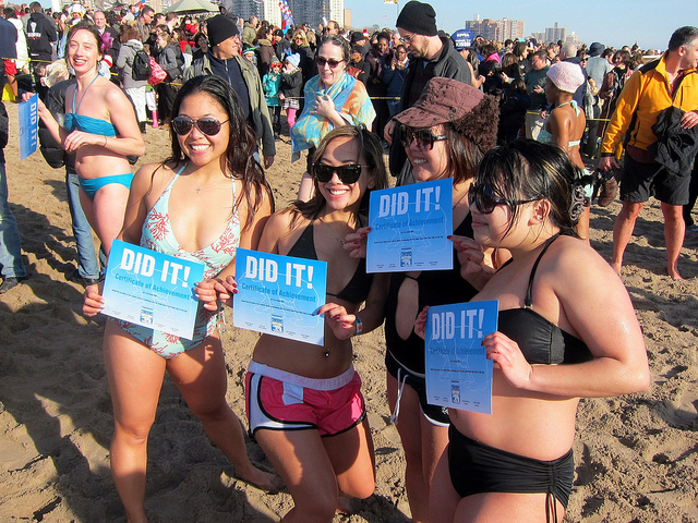 Girls proudly displaying their Polar Bear Plunge Certificates