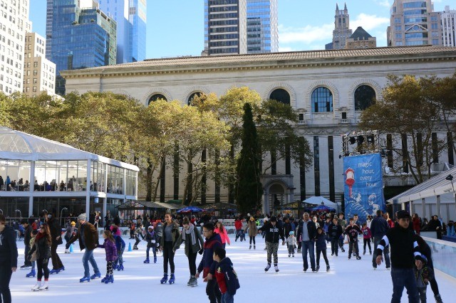 Ice skating in NYC at the Bryant Park ice skating rink.