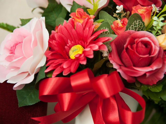 multiple types of colorful flowers in a vase