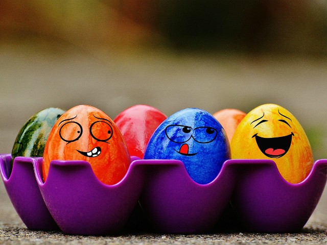funny facial expressions on colorful easter eggs