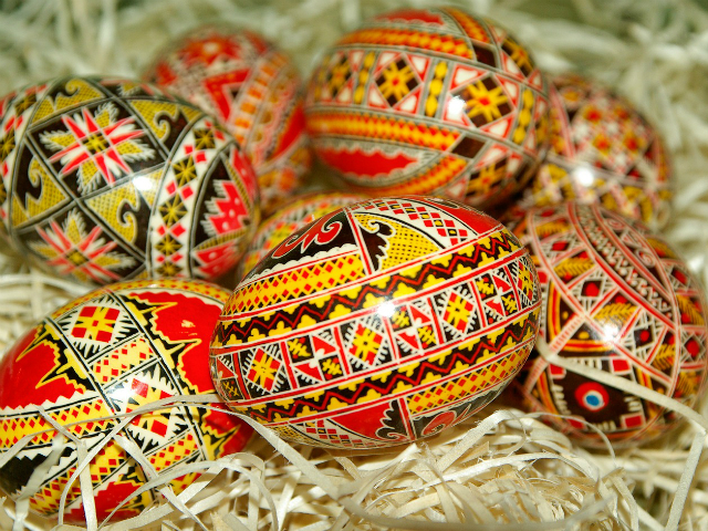 decorated easter eggs in a hay nest
