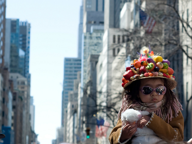 little girl in a colorful bonnet at Easter Parade in NYC