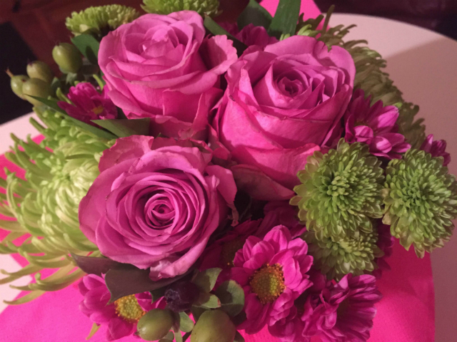 vase of pink flowers in an apartment