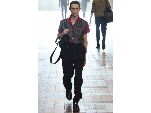 Male model wearing fifties shirt on runway in Spring 2016 fashion show