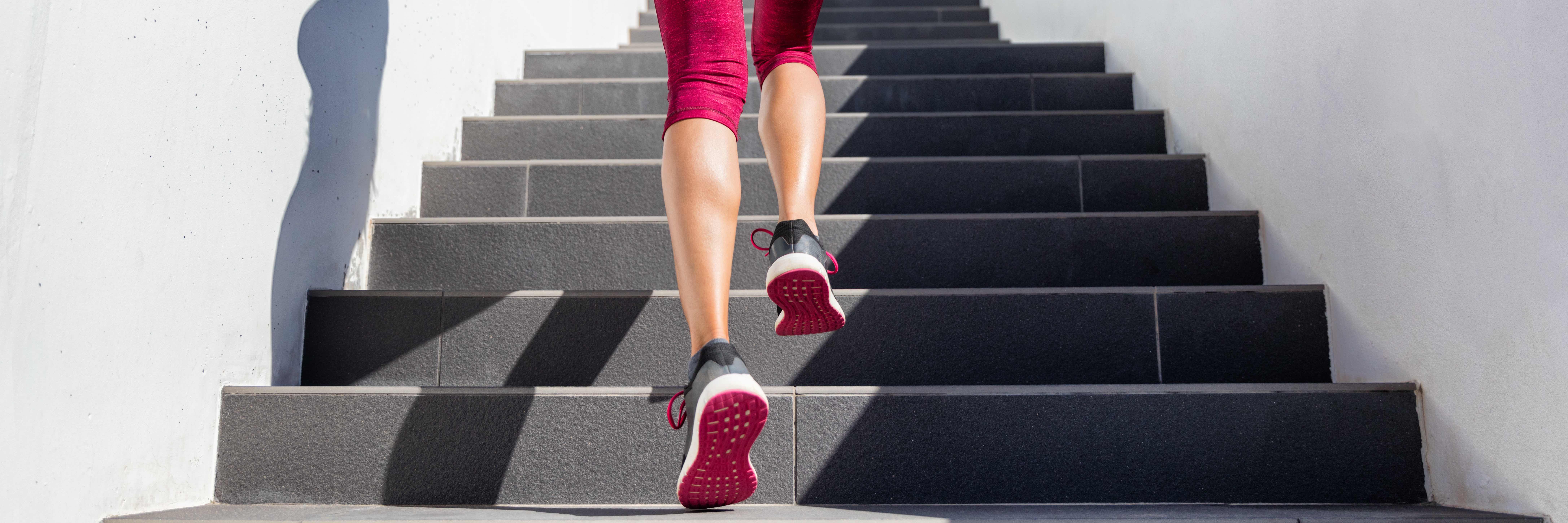 A woman running up her stairs